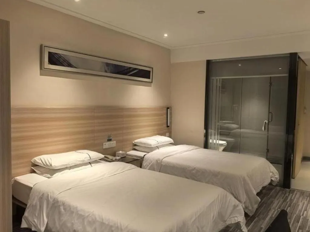 Bed in City Comfort Inn Huanggang Qichun Exhibition Center