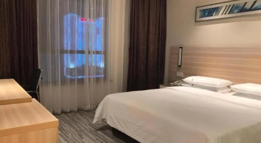 Bed in City Comfort Inn Huanggang Qichun Exhibition Center