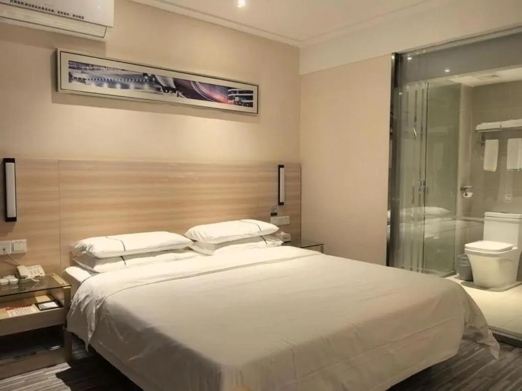 Bed in City Comfort Inn Huanggang Qichun Exhibition Center