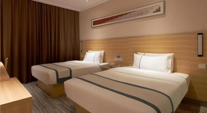 Bed in City Comfort Inn Liuzhou Wuxing Walking Street