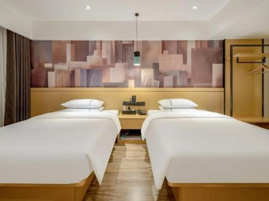 Bed in City Comfort Inn Hezhou Huangyao Ancient Town