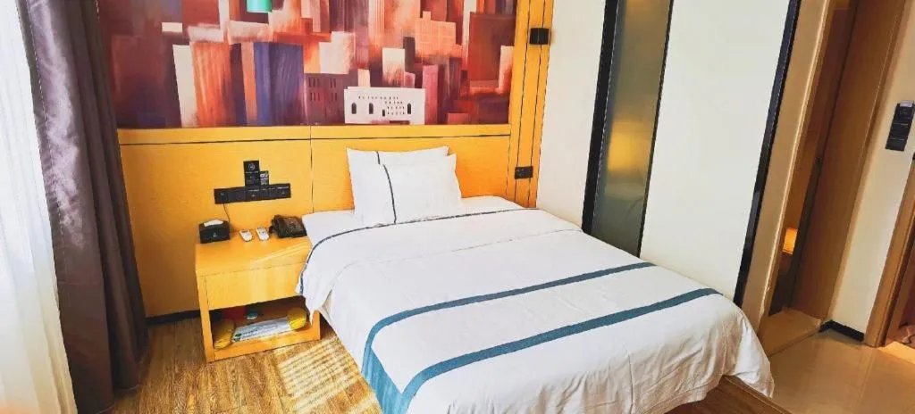 Bed in City Comfort Inn Hezhou Huangyao Ancient Town