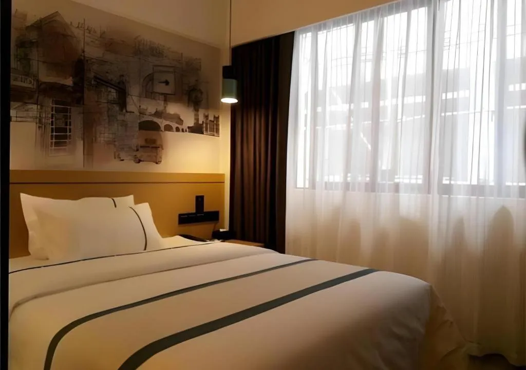 Bed in City Comfort Inn Hezhou Huangyao Ancient Town