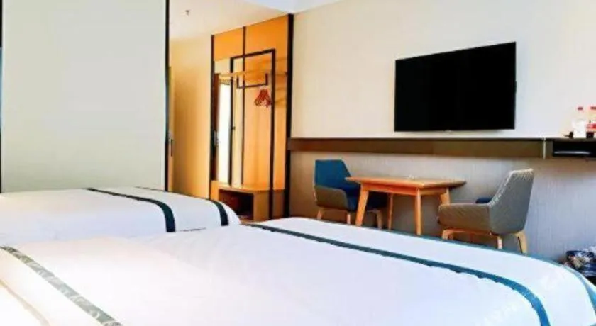 Bed in City Comfort Inn Hezhou Huangyao Ancient Town