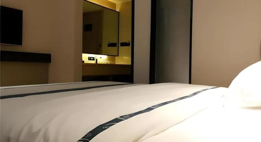 Bed in City Comfort Inn Hezhou Huangyao Ancient Town