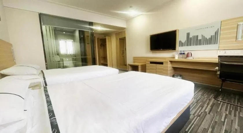 Bed in City Comfort Inn Zhongshan Dongsheng One Plus One