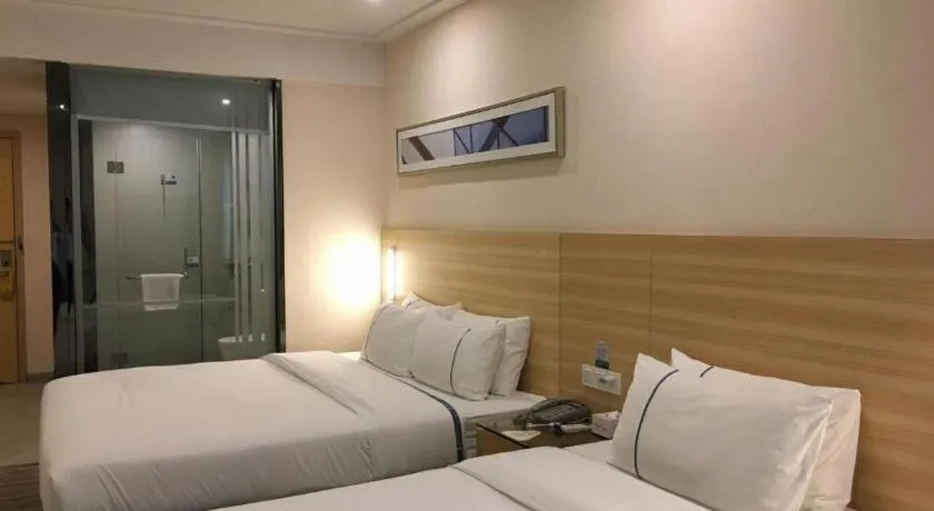 Bed in City Comfort Inn Zhongshan Dongsheng One Plus One