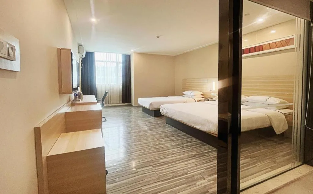 Bed in City Comfort Inn Zhongshan Dongsheng One Plus One