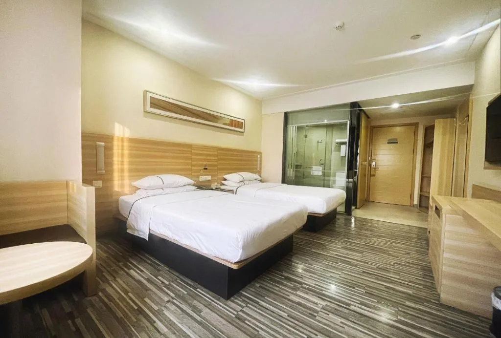 Bed in City Comfort Inn Zhongshan Dongsheng One Plus One