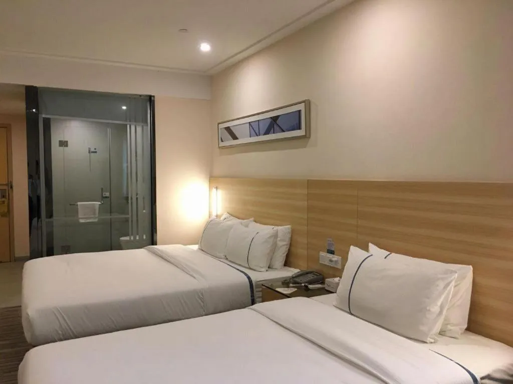 Bed in City Comfort Inn Zhongshan Dongsheng One Plus One