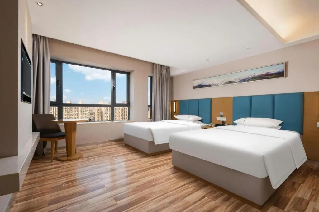 Bed in City Comfort Inn Jingzhou Wanda Plaza