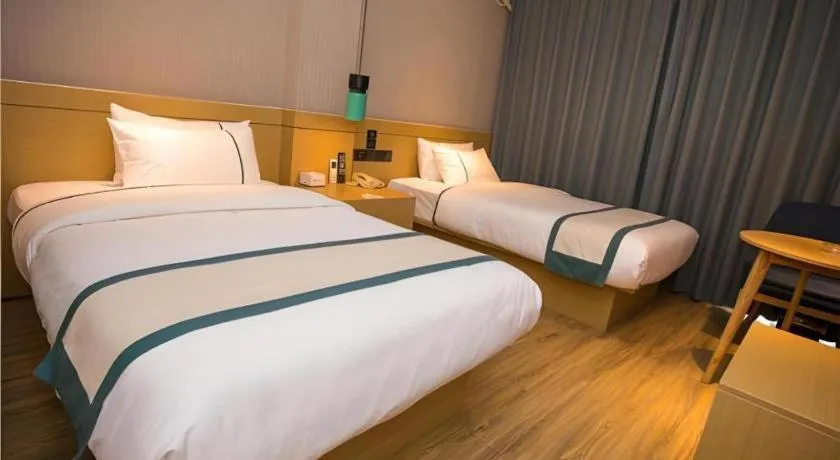 Bed in City Comfort Inn Wuhan Daxueyuan Road Qingfeng Villa