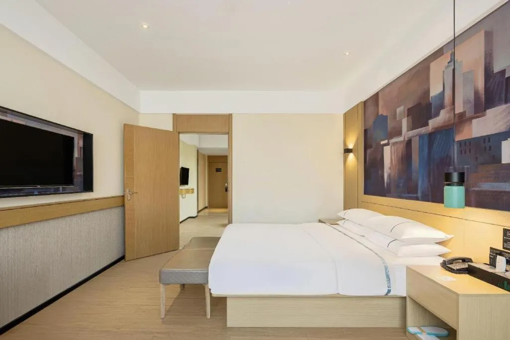 Bed in City Comfort Inn Wuhan Daxueyuan Road Qingfeng Villa