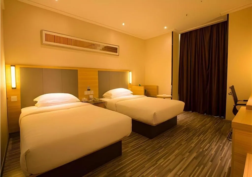 Bed in City Comfort Inn Hechi Chengxi Avenue