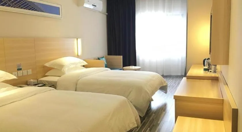 Bed in City Comfort Inn Zhongshan Xiaolan Xinduhui Gymnasium