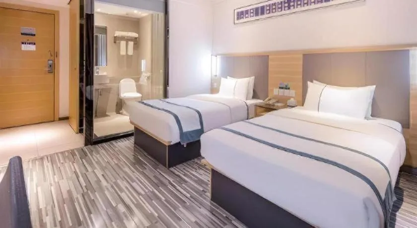 Bed in City Comfort Inn Zhongshan Xiaolan Xinduhui Gymnasium