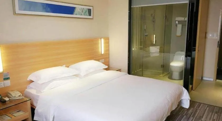 Bed in City Comfort Inn Zhongshan Xiaolan Xinduhui Gymnasium
