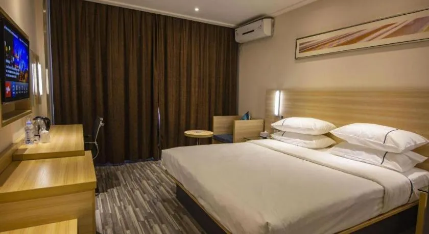 Bed in City Comfort Inn Zhongshan Xiaolan Xinduhui Gymnasium