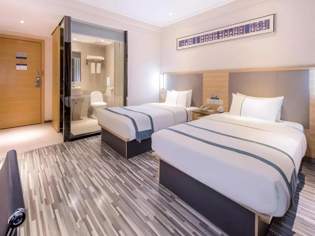 Bed in City Comfort Inn Zhongshan Xiaolan Xinduhui Gymnasium