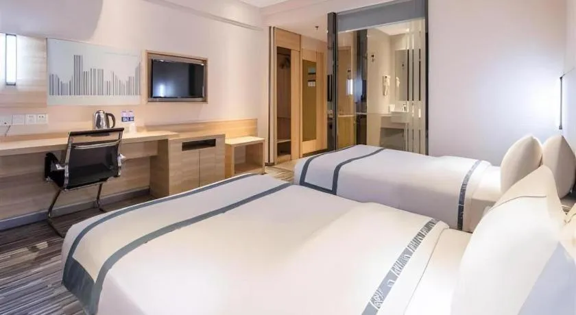 Bed in City Comfort Inn Zhongshan Xiaolan Xinduhui Gymnasium