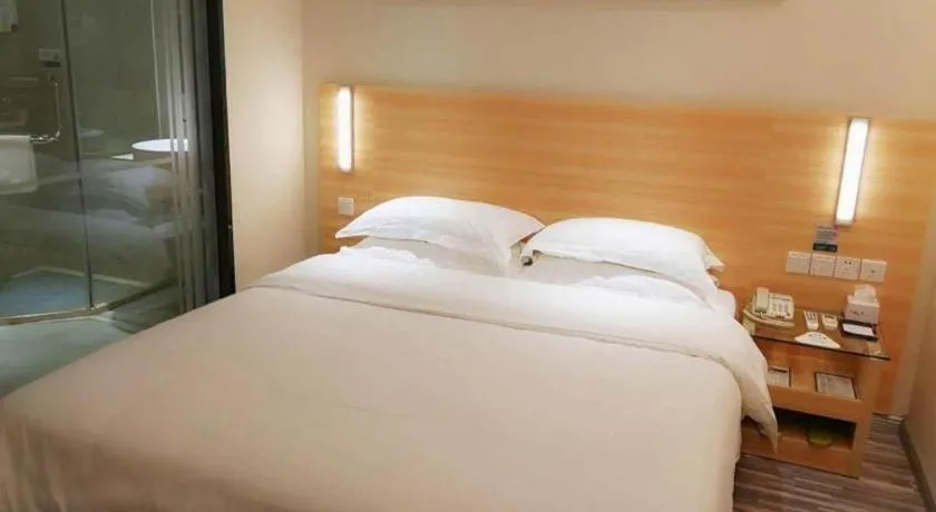 Bed in City Comfort Inn Zhongshan Xiaolan Xinduhui Gymnasium