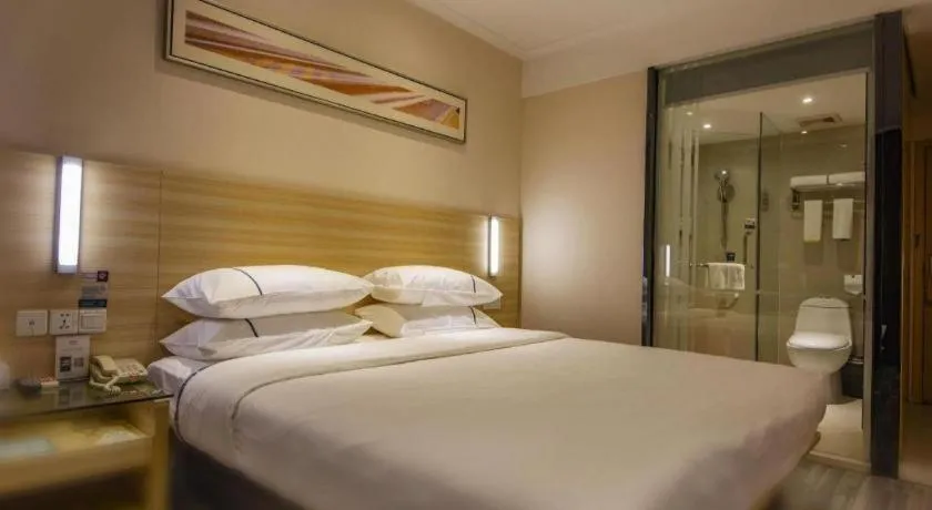 Bed in City Comfort Inn Zhongshan Xiaolan Xinduhui Gymnasium