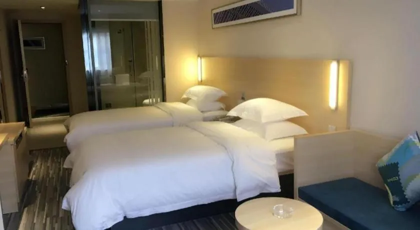 Bed in City Comfort Inn Zhongshan Xiaolan Xinduhui Gymnasium