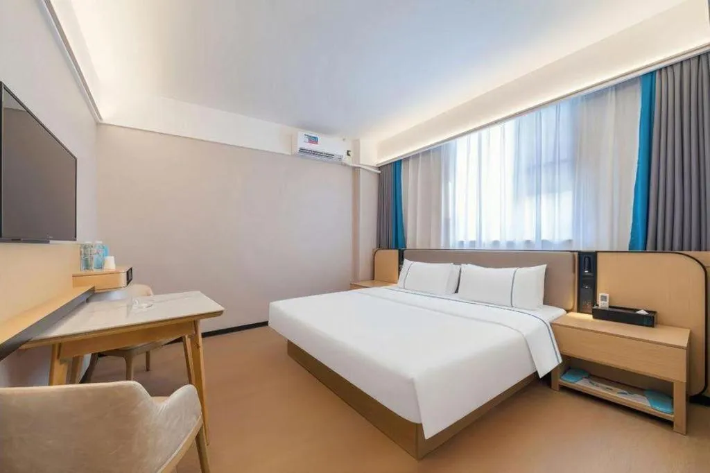 Bed in City Comfort Inn Huanggang Wuxue Bus Center