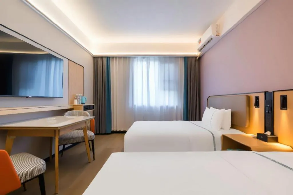 Bed in City Comfort Inn Huanggang Wuxue Bus Center