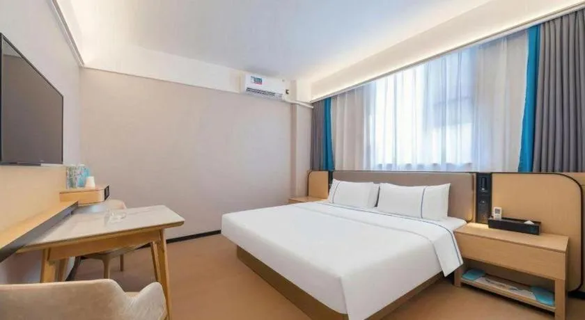 Bed in City Comfort Inn Huanggang Wuxue Bus Center