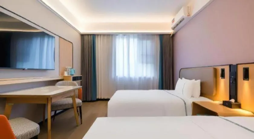 Bed in City Comfort Inn Huanggang Wuxue Bus Center