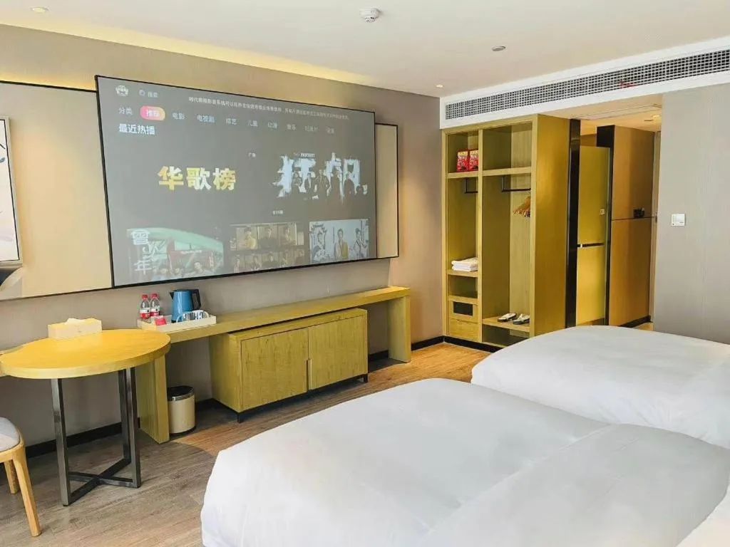 Bed in Echarm Hotel Huangshi Yingbin Avenue