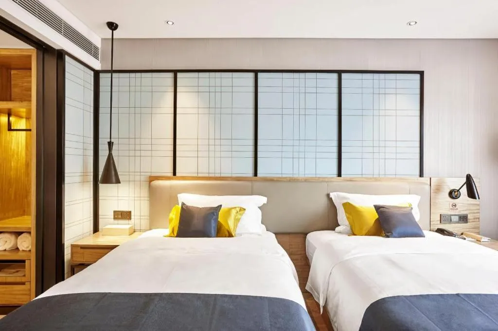 Bed in Echarm Hotel Huangshi Yingbin Avenue