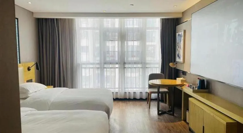 Bed in Echarm Hotel Huangshi Yingbin Avenue