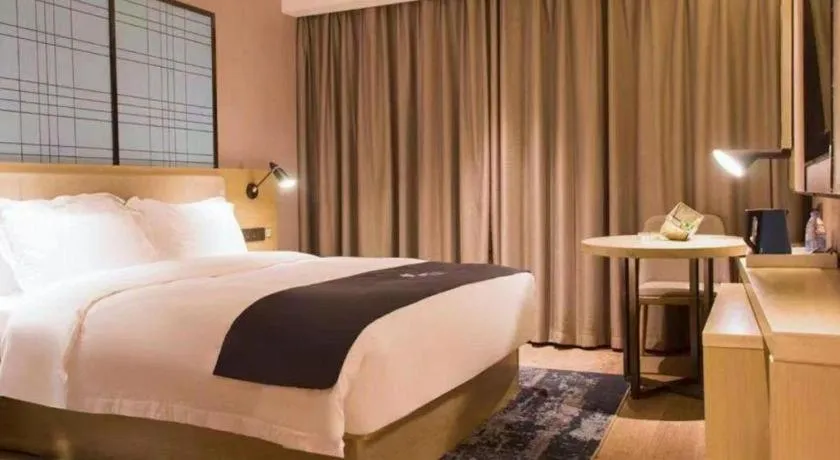 Bed in Echarm Hotel Huangshi Yingbin Avenue