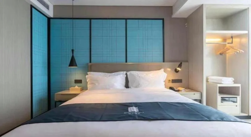 Bed in Echarm Hotel Changchun Jiutai District Government Railway Station