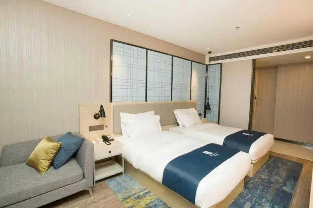 Bed in Echarm Hotel Changchun Jiutai District Government Railway Station