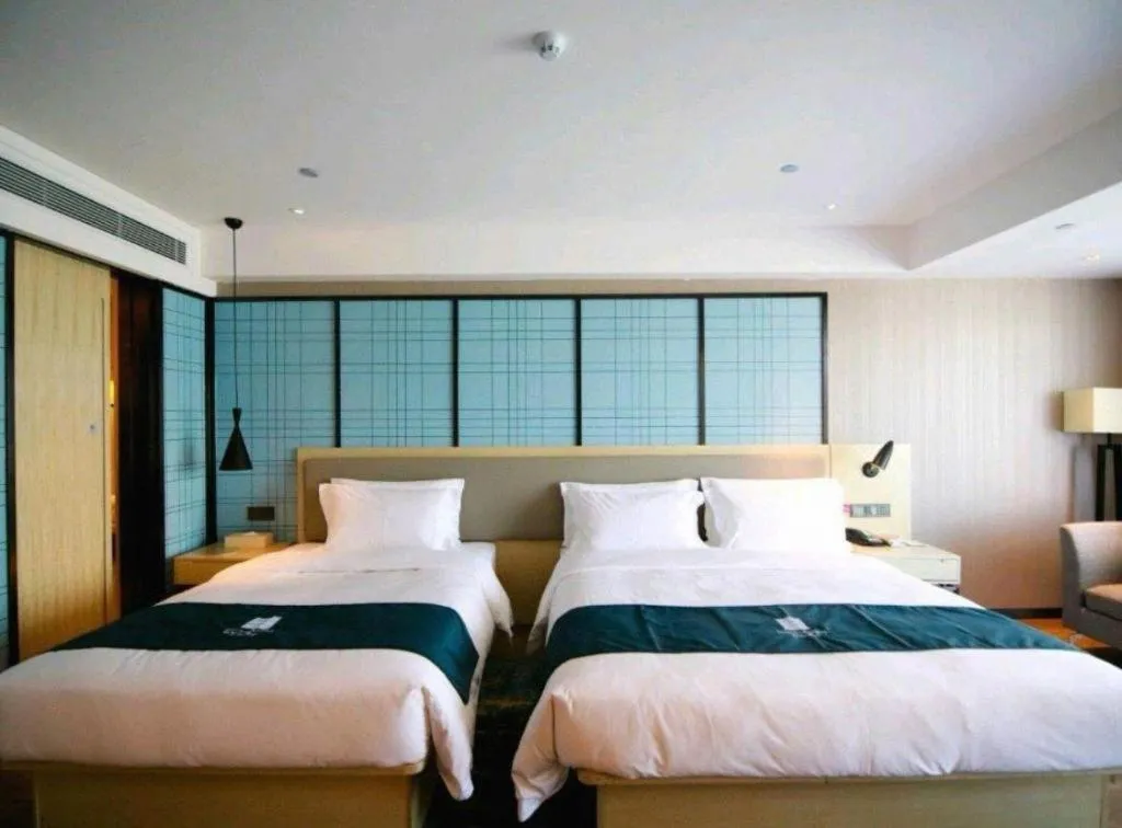 Bed in Echarm Hotel Changchun Jiutai District Government Railway Station