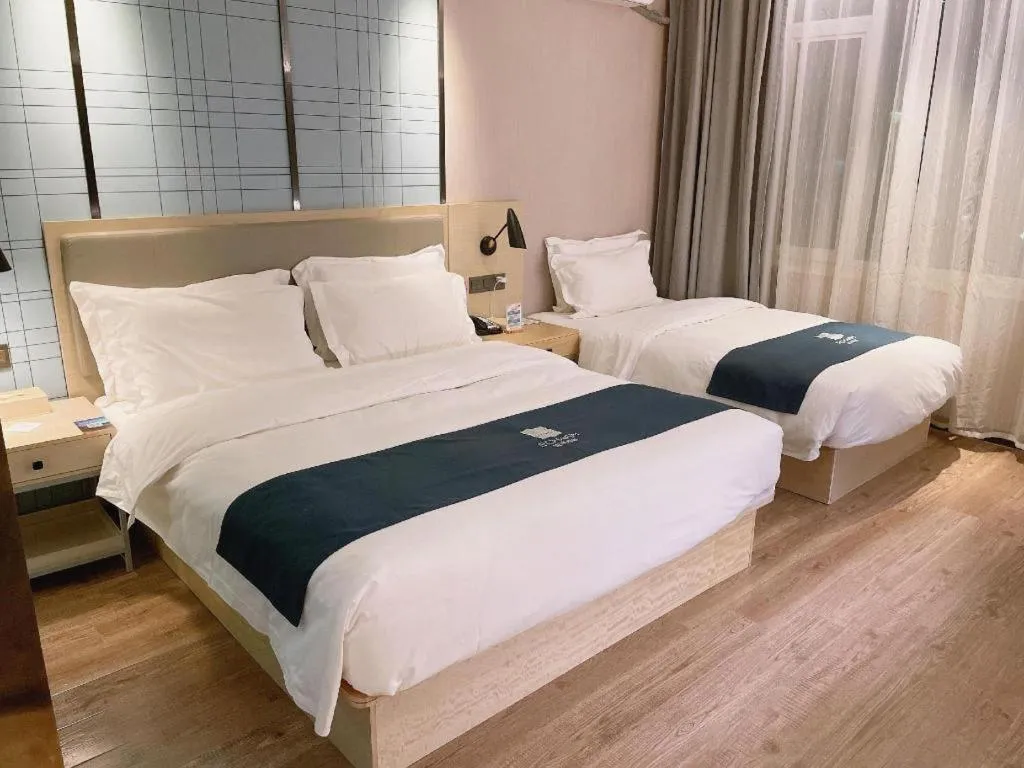 Bed in Echarm Hotel Changchun Jiutai District Government Railway Station