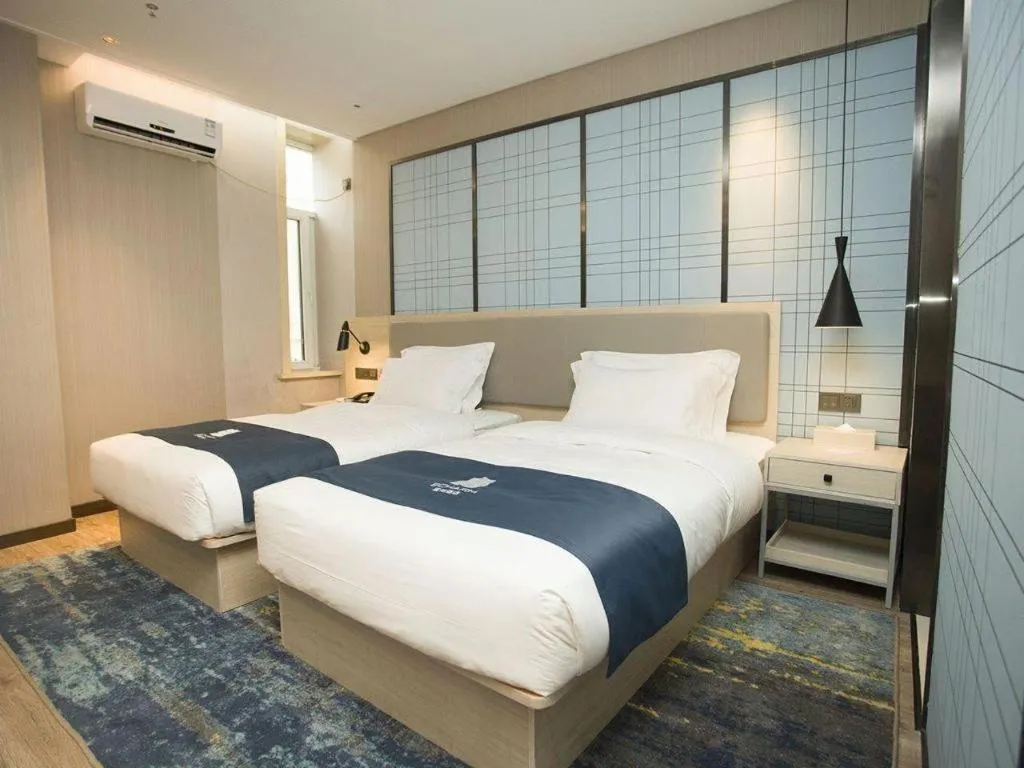 Bed in Echarm Hotel Changchun Jiutai District Government Railway Station