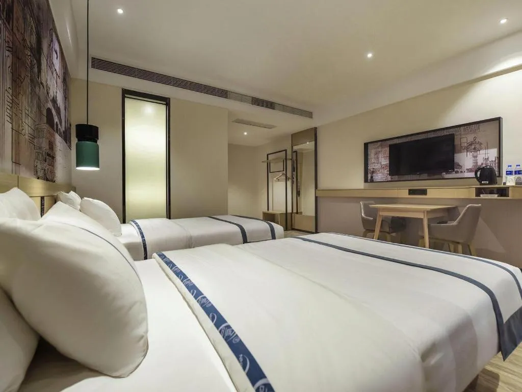 Bed in City Comfort Inn Dongguan Gaobu Avenue