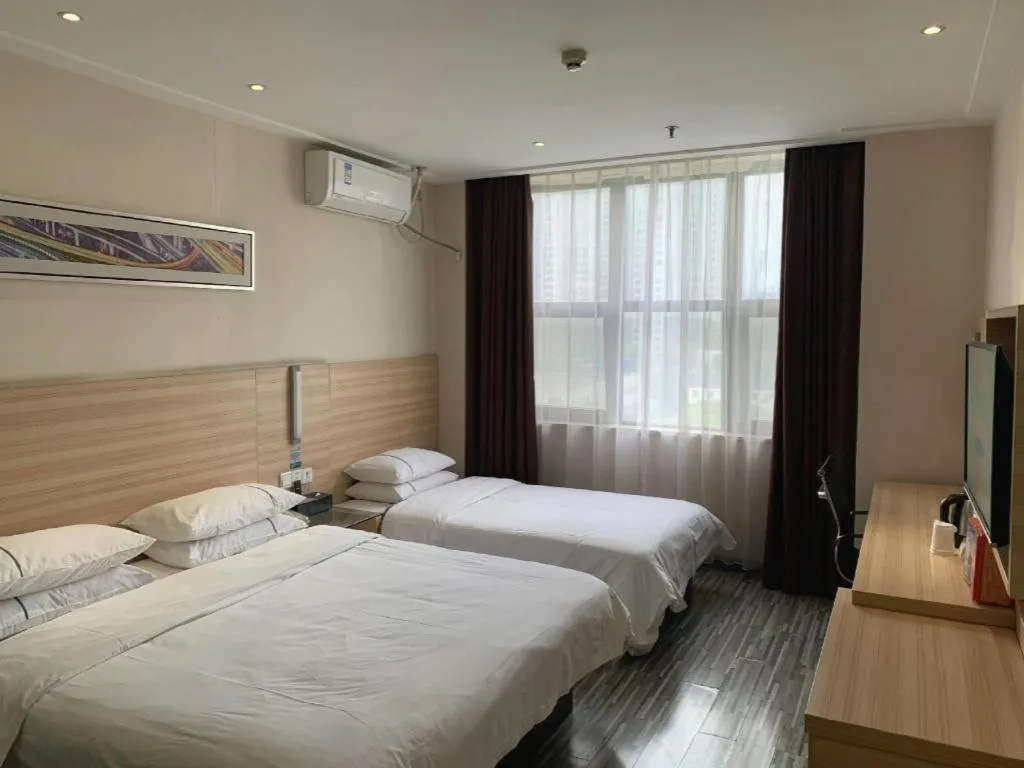 Bed in City Comfort Inn Yichang Dongshan Three Gorges University Shuiyuecheng