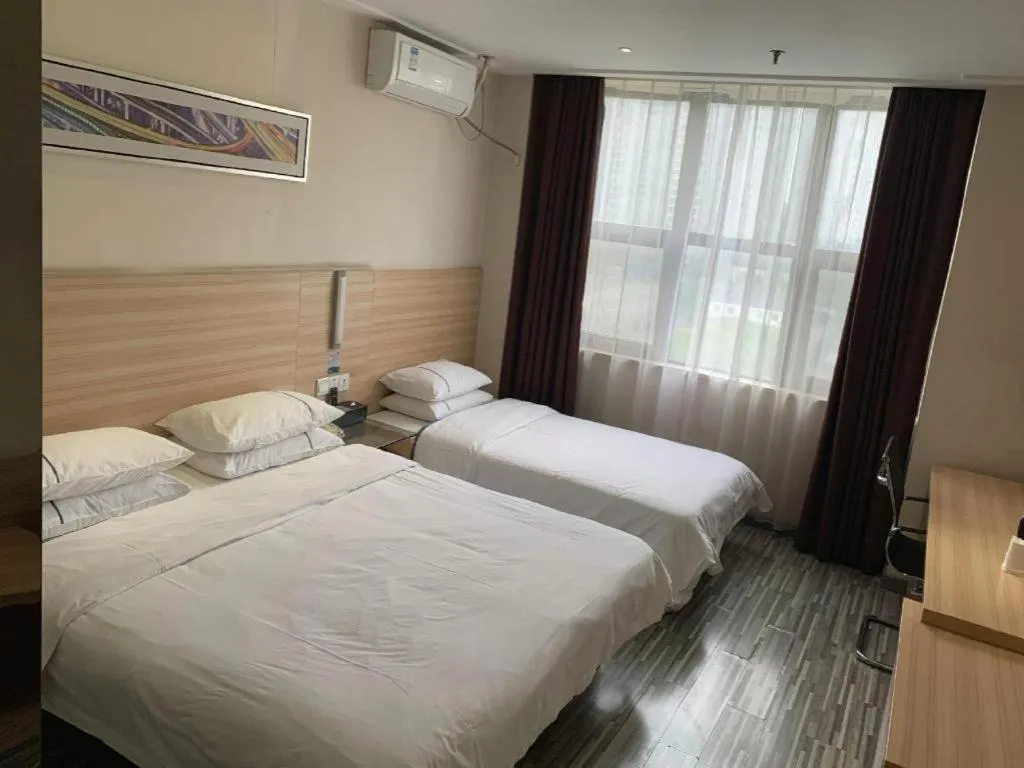 Bed in City Comfort Inn Yichang Dongshan Three Gorges University Shuiyuecheng