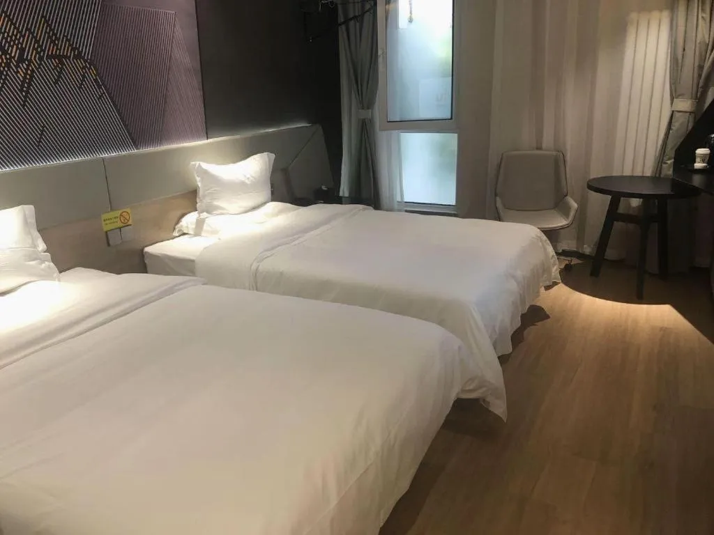 Bed in IU Hotels· Tianjin Houtai Chengjian University Haitai Industrial Park