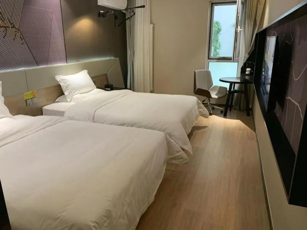 Bed in IU Hotels· Tianjin Houtai Chengjian University Haitai Industrial Park