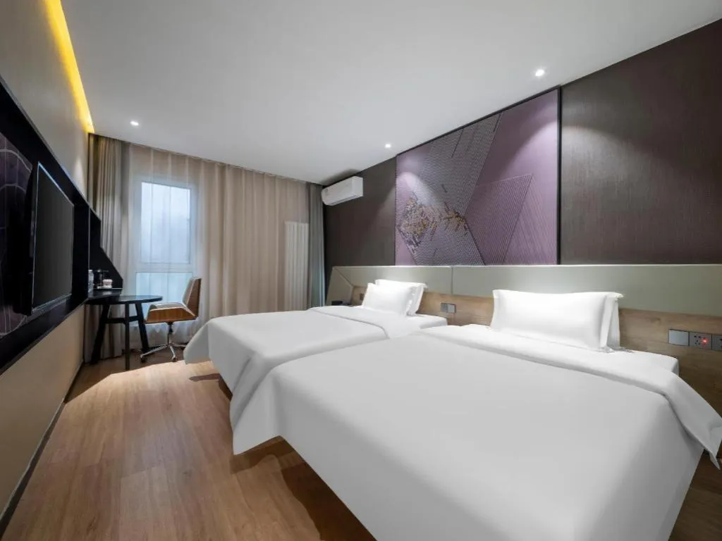 Bed in IU Hotels· Tianjin Houtai Chengjian University Haitai Industrial Park