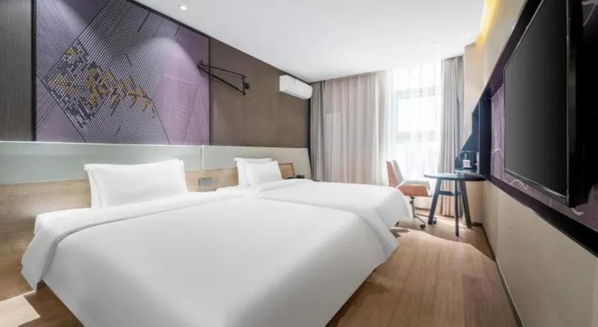 Bed in IU Hotels· Tianjin Houtai Chengjian University Haitai Industrial Park