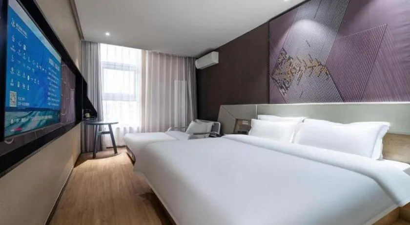 Bed in IU Hotels· Tianjin Houtai Chengjian University Haitai Industrial Park