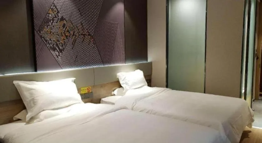 Bed in IU Hotels· Tianjin Houtai Chengjian University Haitai Industrial Park