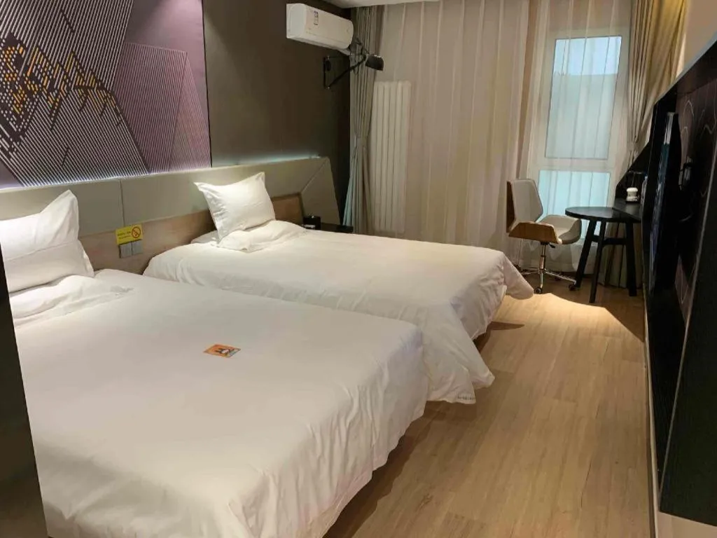Bed in IU Hotels· Tianjin Houtai Chengjian University Haitai Industrial Park